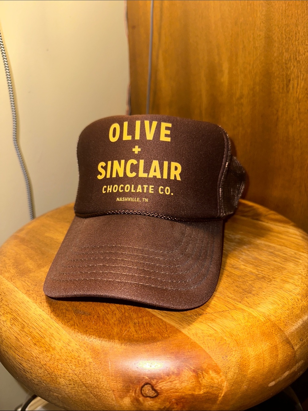 Olive and Sinclair branded trucker hat